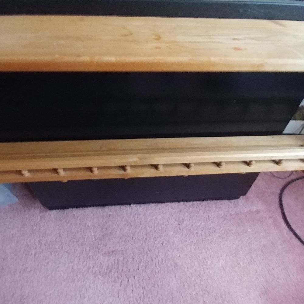 Solid wood coat hanger .